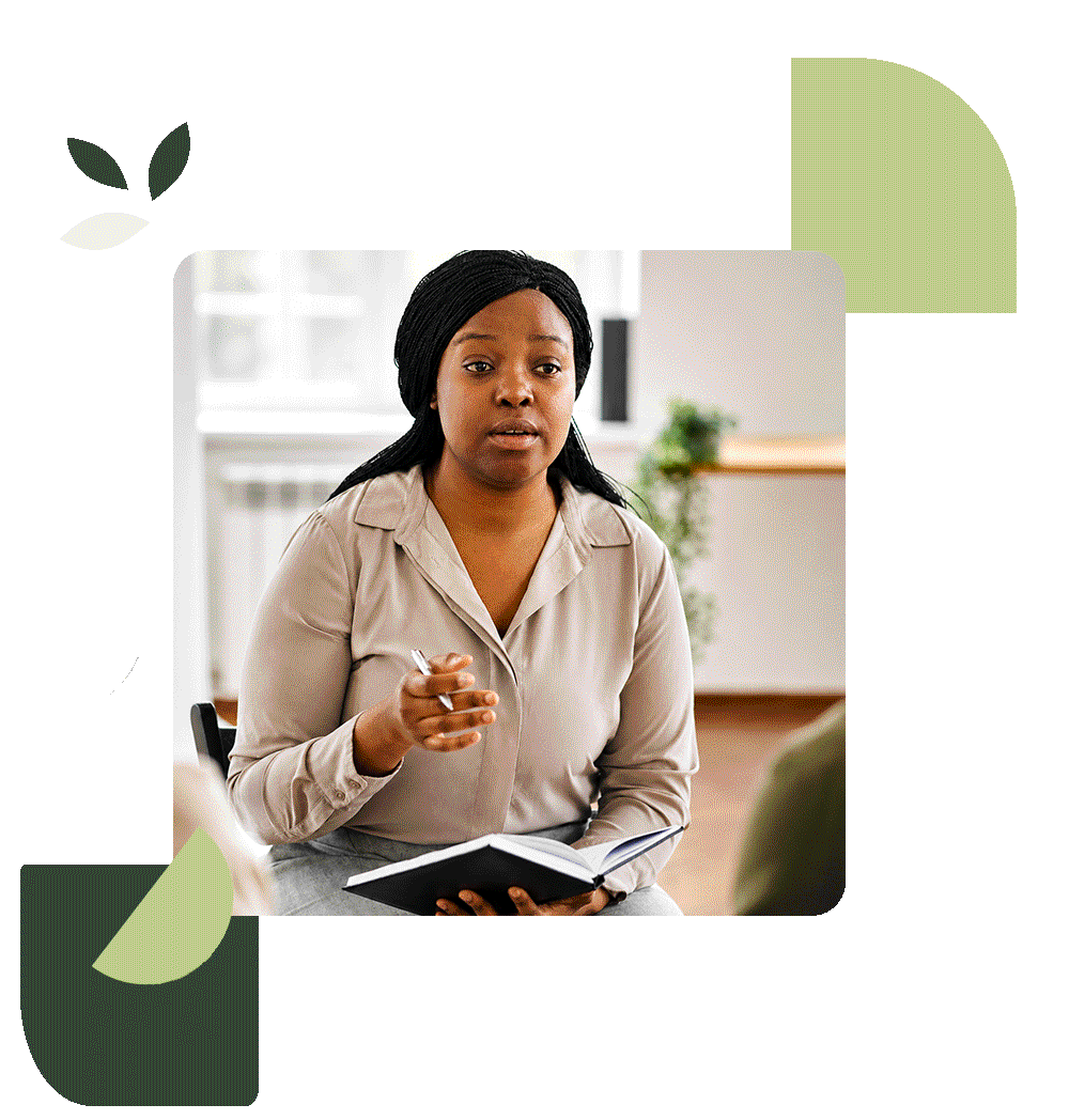 Therapist holding a notebook during a counselling session